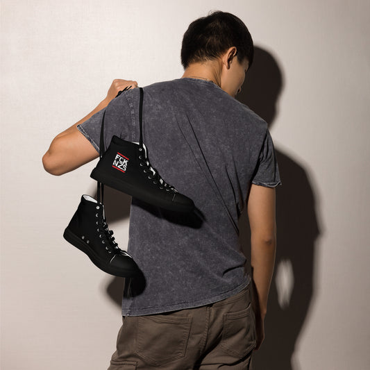 „Schwarze Herren‑Canvas‑Schuhe mit FCK NZS Logo.“